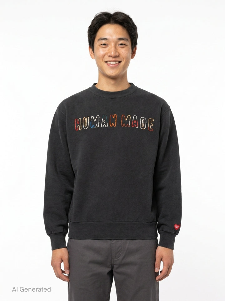Human Made Embroidered Crewneck Sweatshirt in washed black with multicolour chain-stitch logo lettering across the chest and a heart logo patch on the cuff - front