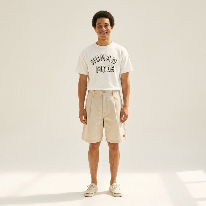 Human Made black short sleeve graphic t-shirt with white and grey hand-drawn arched logo print on the chest - lifestyle