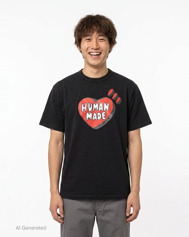 Human Made black short sleeve crew neck t-shirt with a large red hand-drawn heart graphic and 'Human Made' bubble lettering on the chest - front