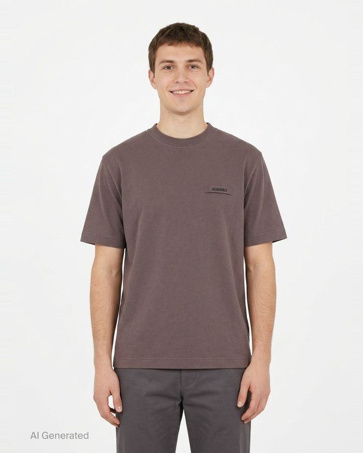 Jacquemus Le T-shirt Gros Grain in pale yellow, featuring a relaxed fit, crew neck, short sleeves, and a woven Jacquemus grosgrain logo tab on the chest - front