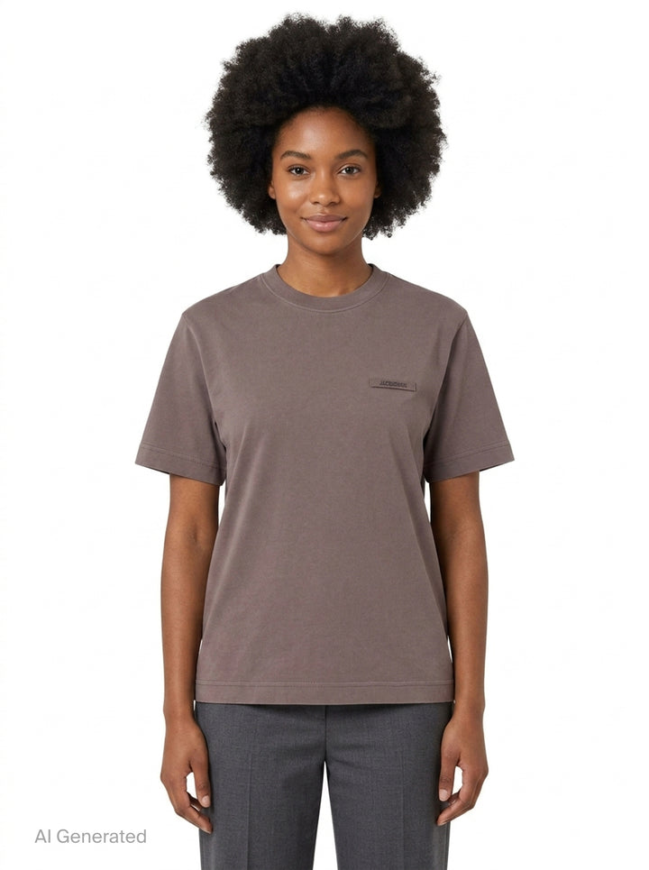 Jacquemus Gros Grain Short Sleeve Tee in cream with a woven grosgrain logo label on the chest - front