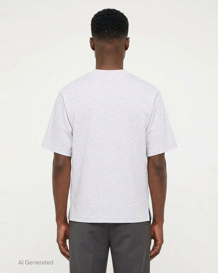 Jacquemus Le T-Shirt Ruban in charcoal grey, featuring a boxy silhouette, crew neckline, and a tonal signature woven label patch at the chest - back