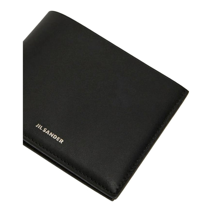 Jil Sander Soft Calf Pocket Wallet in black smooth leather with silver-tone embossed logo lettering on the front face - packshot