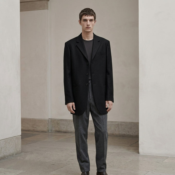 Jil Sander black single-breasted wool mohair jacket with notch lapels and three-button closure, shown from the front - lifestyle