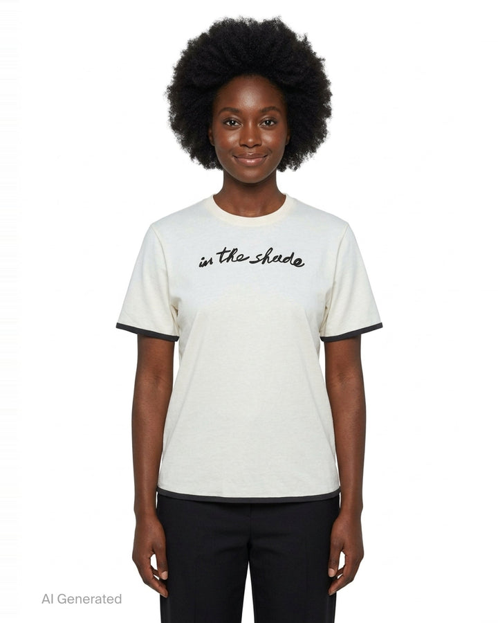 JW Anderson navy short sleeve t-shirt with red cursive 'in the shade' chest embroidery and contrast red sleeve and hem trim detailing - front