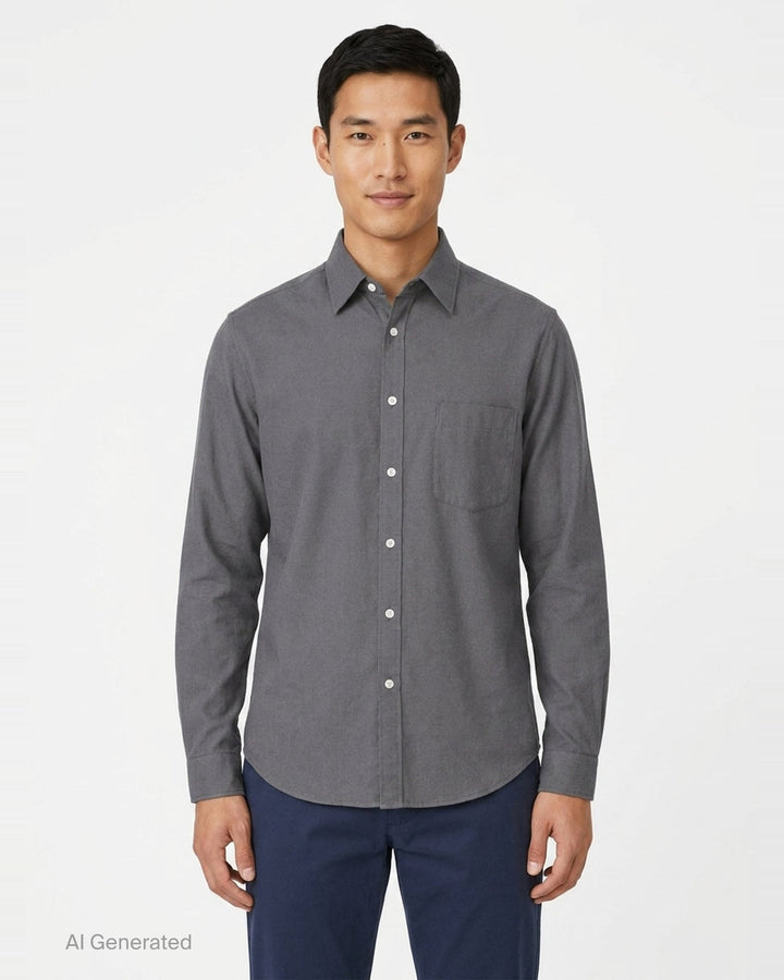 Lemaire Regular Long Sleeve Washed Cotton Shirt in slate grey, displayed flat against a white background, featuring a classic collar, white buttons, and a chest patch pocket - front