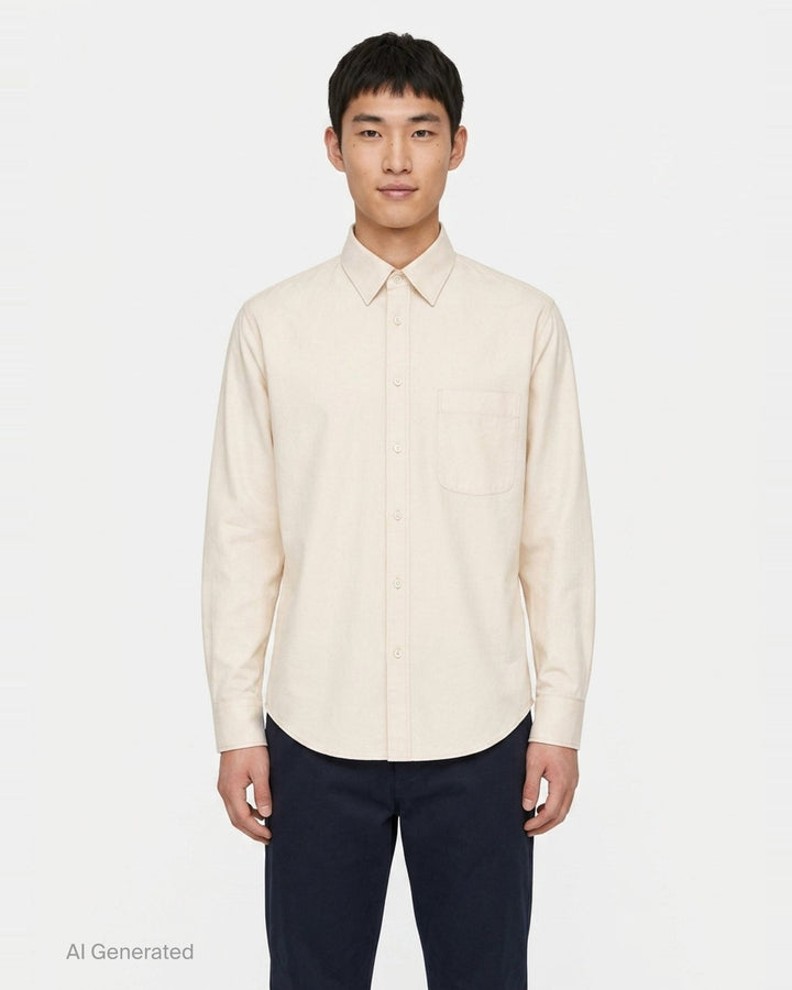 Lemaire Regular Long Sleeve Washed Cotton Shirt in slate grey, displayed flat against a white background, featuring a classic collar, white buttons, and a chest patch pocket - front