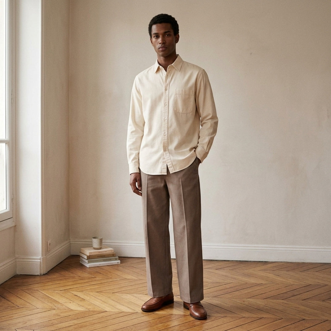 Lemaire Regular Long Sleeve Washed Cotton Shirt in slate grey, displayed flat against a white background, featuring a classic collar, white buttons, and a chest patch pocket - lifestyle
