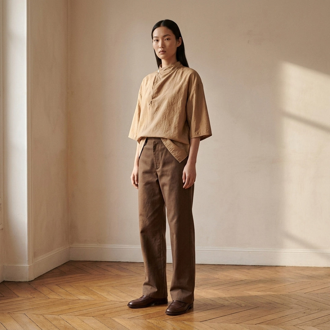 Lemaire straight-leg pants in brown heavy cotton twill, shown from the front - lifestyle