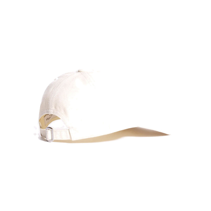 Maison Kitsuné Fortune Fox Cap in cream with an embroidered black fox head patch on the front and a curved brim - packshot