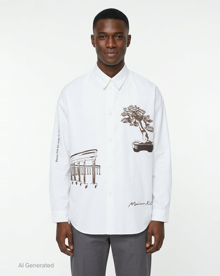 Maison Kitsuné Parcs of Paris Oversize Shirt in white, featuring brown bonsai tree and colonnade graphic prints on the body and a signature script logo at the hem - front