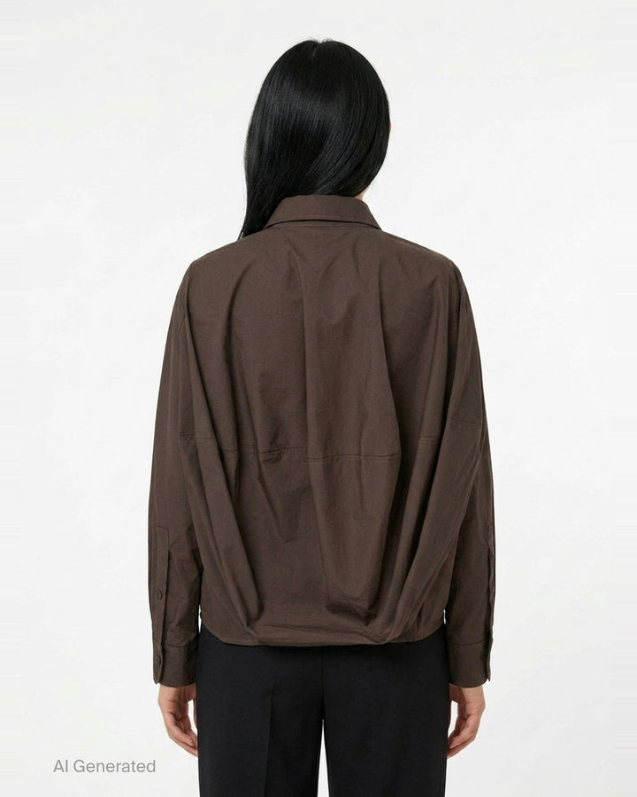 Melitta Baumeister Long Sleeve Cocoon Shirt in chocolate brown with rounded collar, contrast topstitching, chest patch pocket, and gathered elasticated hem band - back