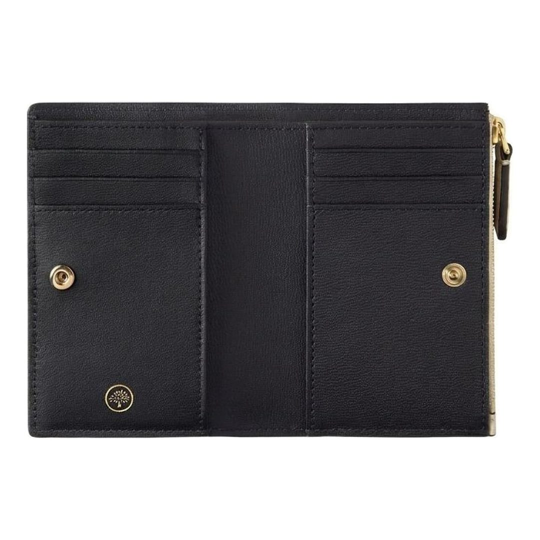 Mulberry Continental Bifold Zipped Wallet in pale stone pebbled leather with gold-tone zip hardware and embossed Mulberry logo, photographed flat against a light grey background - packshot