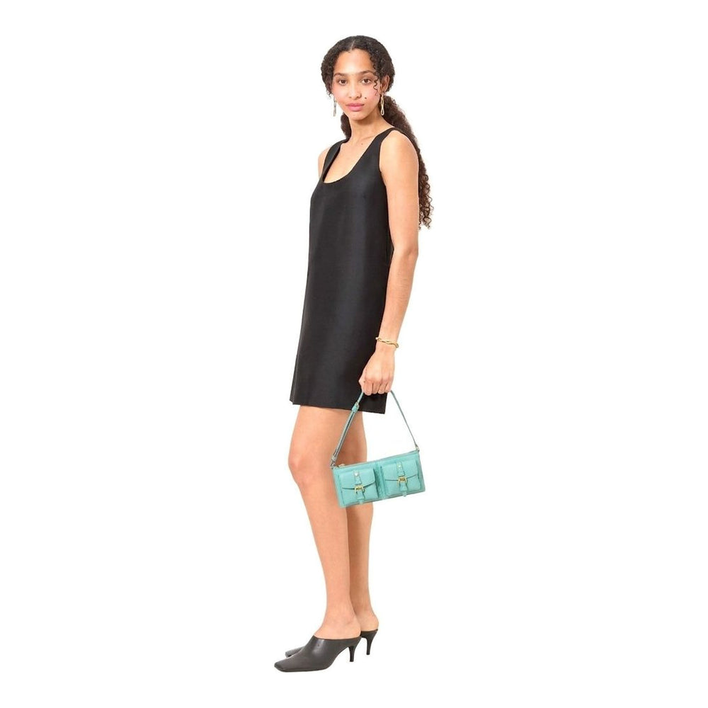Mulberry Roxanne Mini Shoulder Bag in mint green pebbled leather, featuring two buckle-fastened front pockets, a zip top closure, and a slim adjustable shoulder strap with gold-tone hardware - packshot