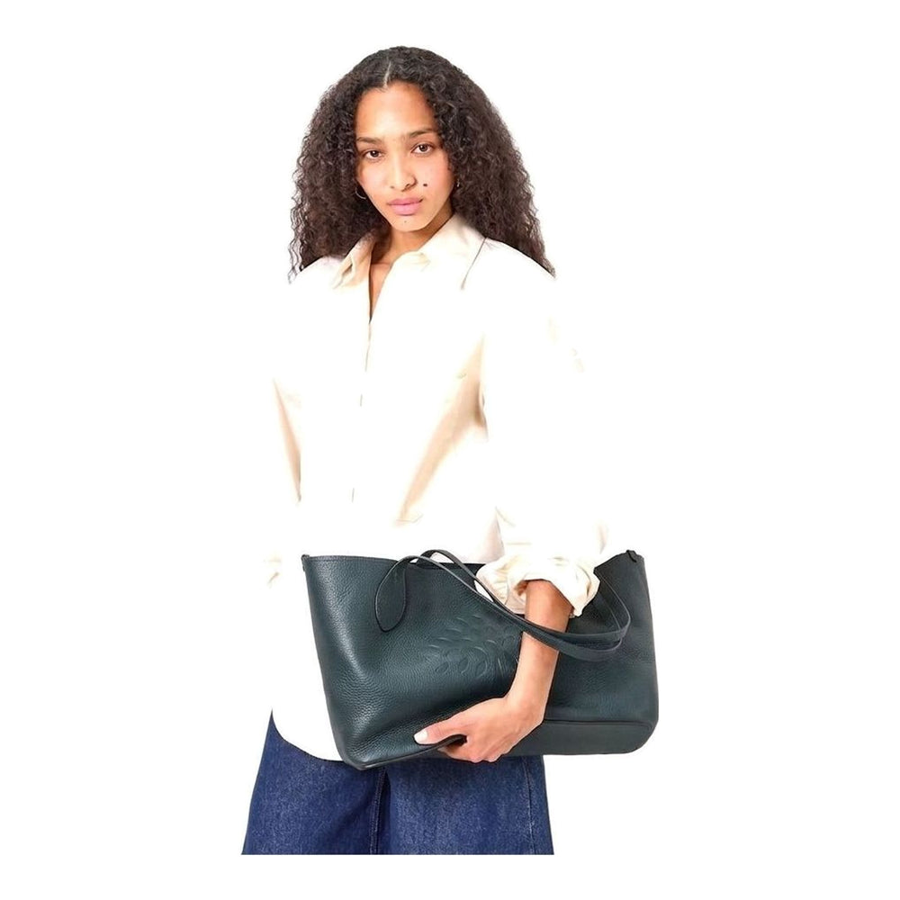 Mulberry Tree Tote in black heavy grain leather, featuring tonal cutwork Mulberry tree motif on the front panel and twin flat shoulder straps with teardrop finials - packshot