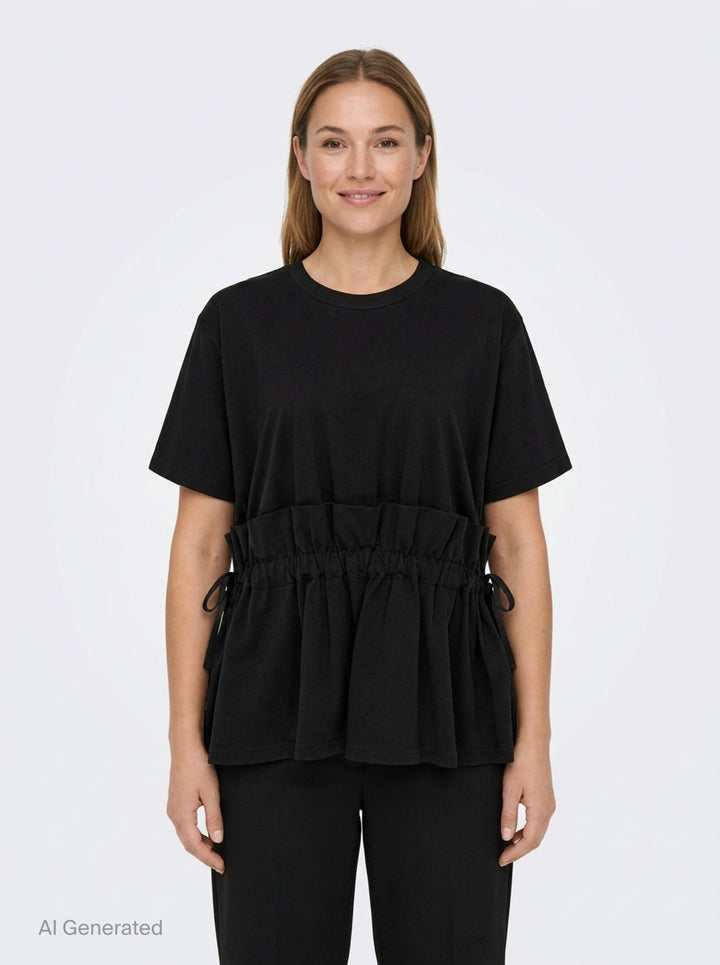 Noir Kei Ninomiya black short-sleeve cotton peplum tee with ruched gathered waistband, drawstring self-ties, and a tiered flared hem, shown flat on a white background - front