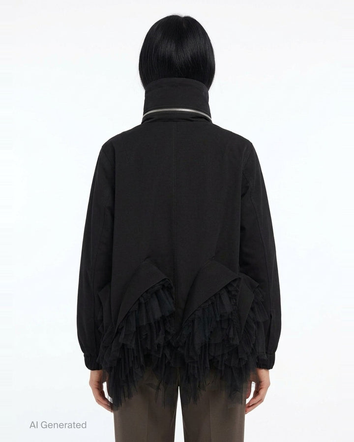 Noir Kei Ninomiya black oversized long sleeve jacket with high drawstring neck, silver zip closures, angled chest zip pockets, and layered black tulle ruffle hem, displayed flat on a white background - back