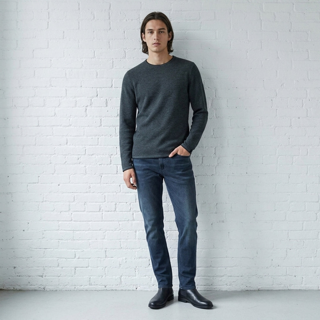 rag & bone Brooks Wool Crew Sweater in deep teal, featuring a slim fit, crew neckline, long sleeves, and raw-edge cuffs, displayed on a flat ghost mannequin - lifestyle