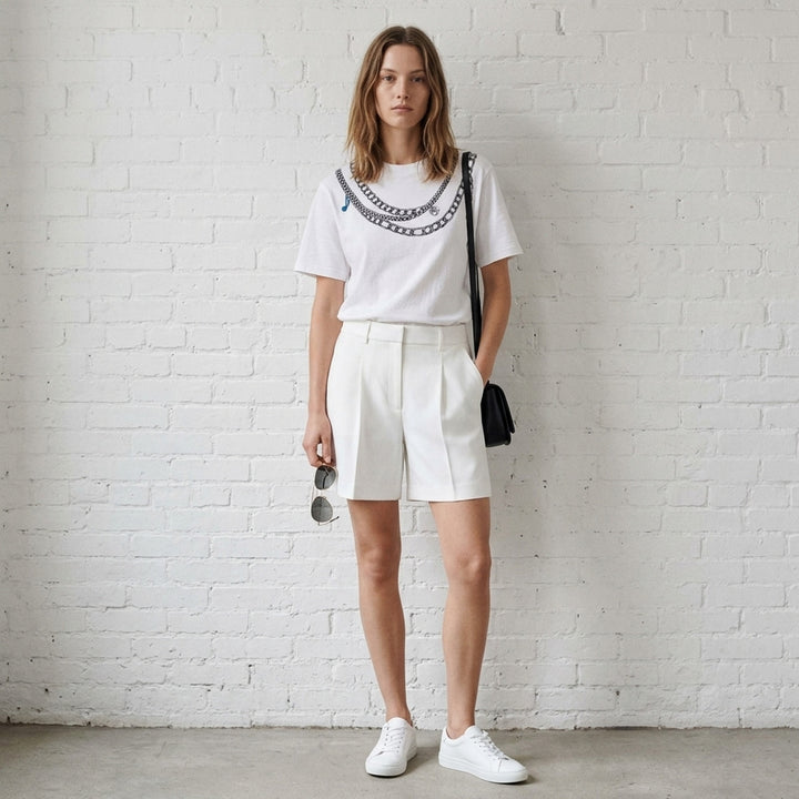 rag & bone Miramar Charms Short Sleeve Tee in white with a trompe l'oeil printed graphic of layered silver chain necklaces and charm details across the chest - lifestyle