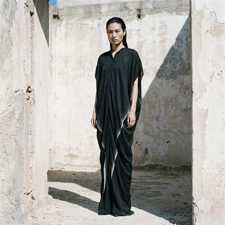 Rick Owens Dagger Gown in black, a floor-length draped column dress with cap sleeves and a pale ombré gradient running down the back - lifestyle