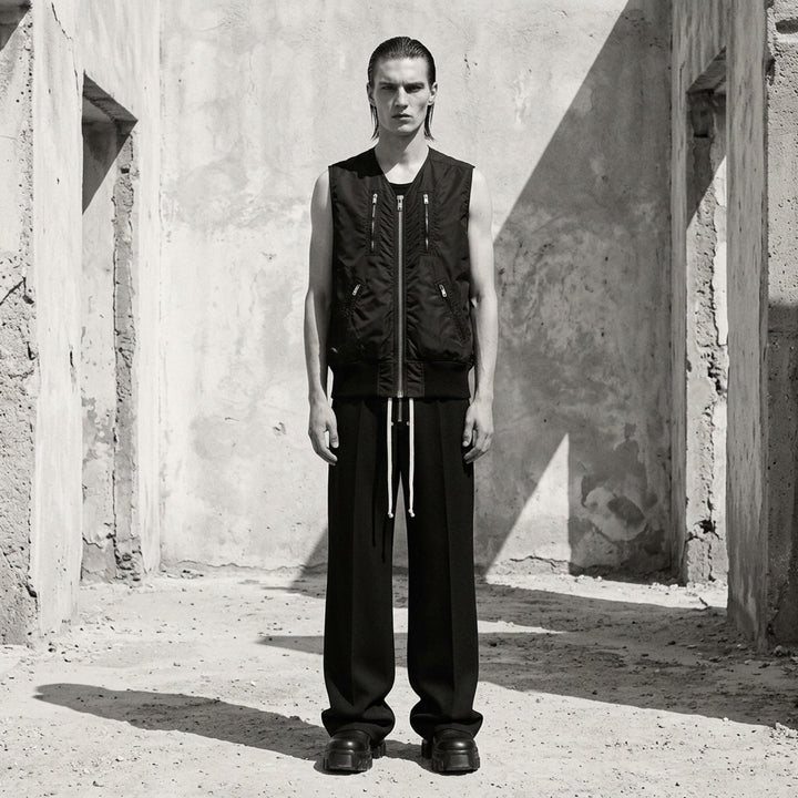 Rick Owens black washed nylon sleeveless bomber vest with V-neckline, silver front zip, four zip pockets and ribbed knit hem - lifestyle