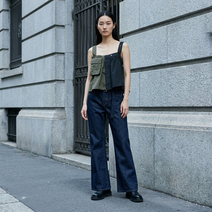 sacai x Levi's mid-blue washed flare jeans with an integrated black woven belt, shown from the front - lifestyle