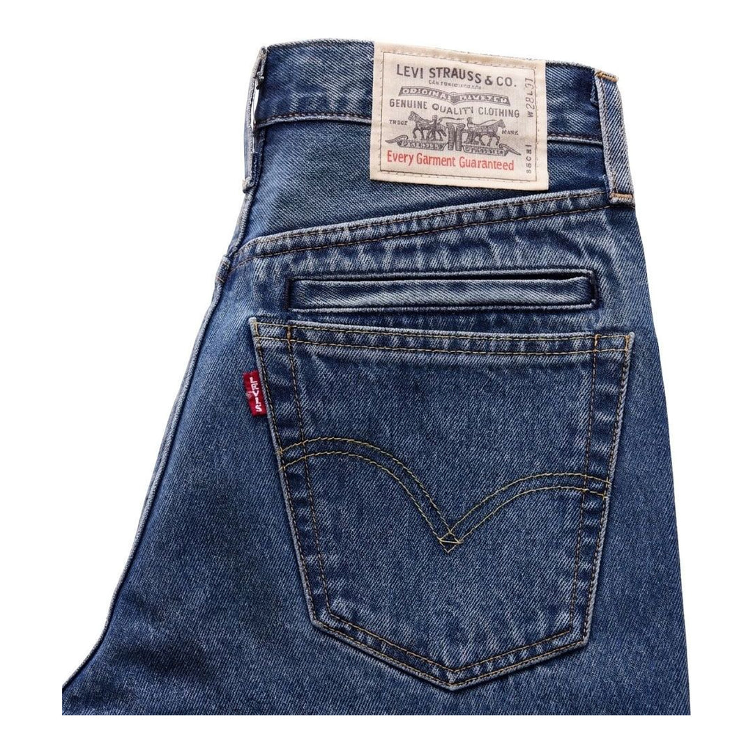 sacai x Levi's mid-blue washed flare jeans with an integrated black woven belt, shown from the front - packshot