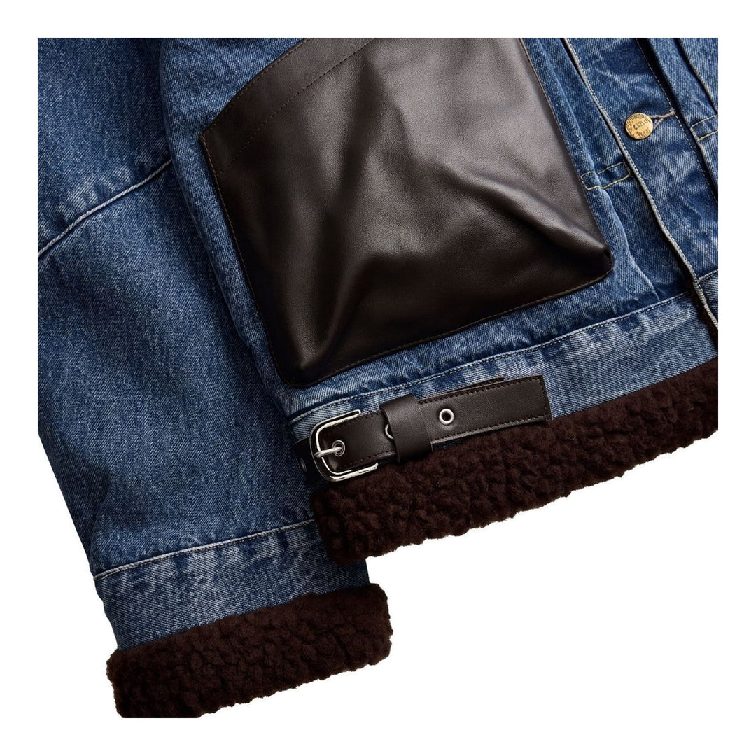 sacai Holiday Capsule mid-blue denim blouson with brown sherpa collar, cuffs and hem, an oversized leather front pocket and buckled side straps - packshot