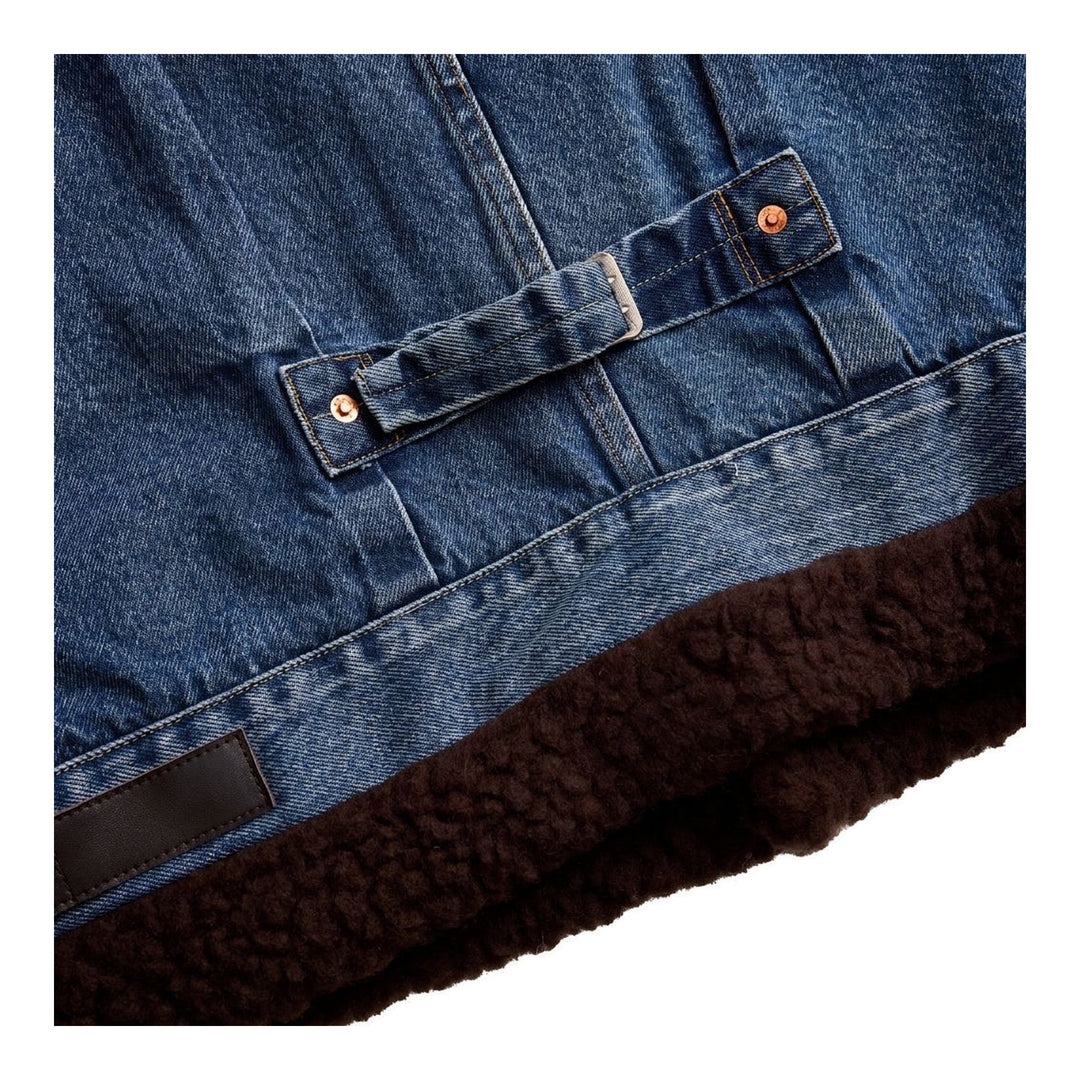 sacai Holiday Capsule mid-blue denim blouson with brown sherpa collar, cuffs and hem, an oversized leather front pocket and buckled side straps - packshot