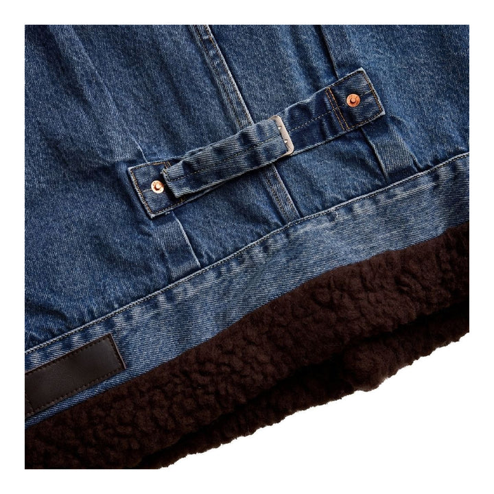 sacai Holiday Capsule mid-blue denim blouson with brown sherpa collar, cuffs and hem, an oversized leather front pocket and buckled side straps - packshot