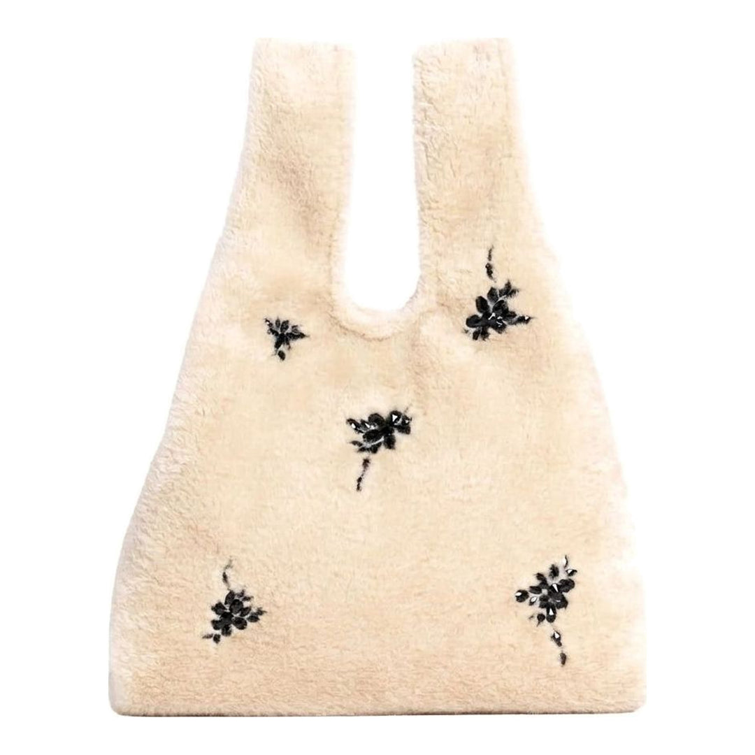 Simone Rocha cream faux fur shopper bag with scattered black crystal floral embellishments and twin top handles - packshot