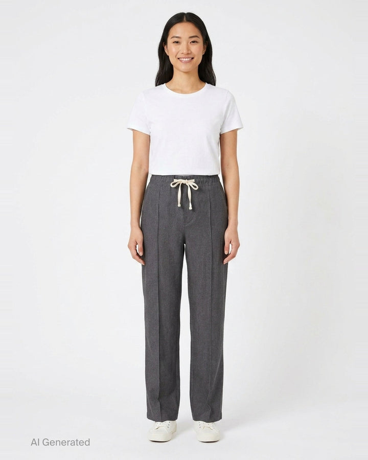 Sonia Carrasco Pleated Drawstring Trousers in heathered charcoal grey, featuring a wide-leg silhouette, front pleats, and a contrast cream drawstring bow at the elasticated waist - front