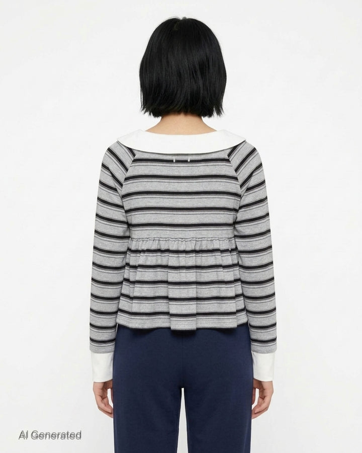 Sultry Virgin Stripe Babydoll Polo in grey and black stripes with a white Peter Pan collar, pink button placket, gathered peplum hem, and white cuff trim on long sleeves - back