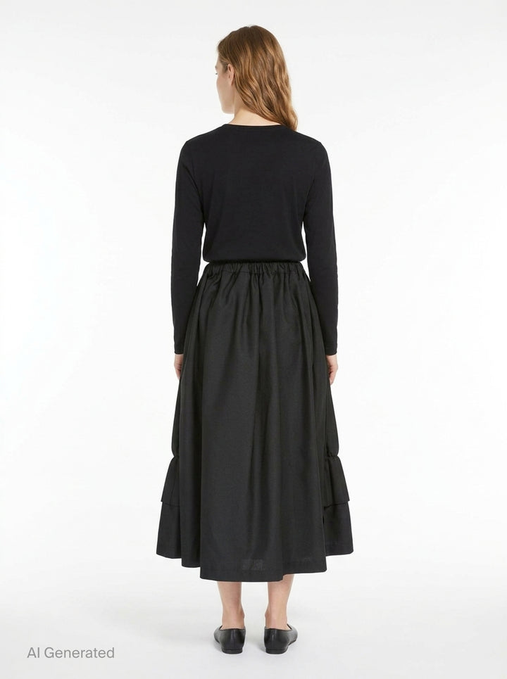 Tao black layered pleated midi skirt with elasticated waist, vertical pleats, gathered mid-section, and double-tiered ruffled hem, displayed on white background - back