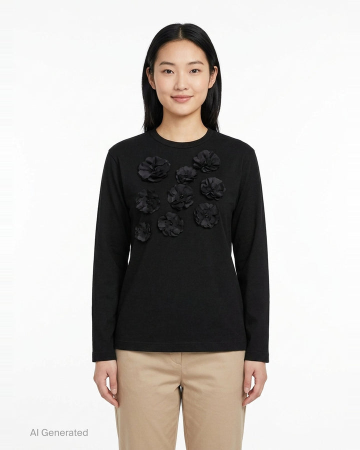 Tao black long sleeve crew neck top with nine tonal satin 3D floral appliqués and bead centres scattered across the chest, shot flat on a white background - front