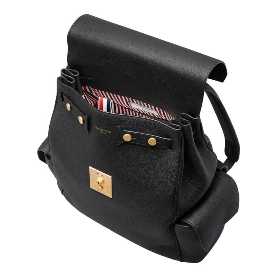 Thom Browne Bolton backpack in black soft pebble leather with brass-tone lock closure, flap side pockets, and red, white, and blue tab detail - packshot