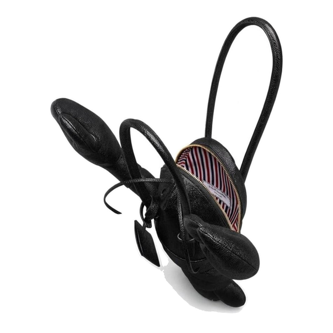 Thom Browne black pebble-grain leather lobster-shaped tote bag with raised claws, rolled handles and a luggage tag - packshot