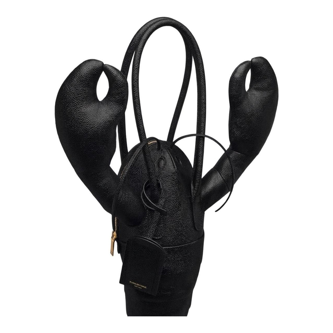 Thom Browne black pebble-grain leather lobster-shaped tote bag with raised claws, rolled handles and a luggage tag - packshot