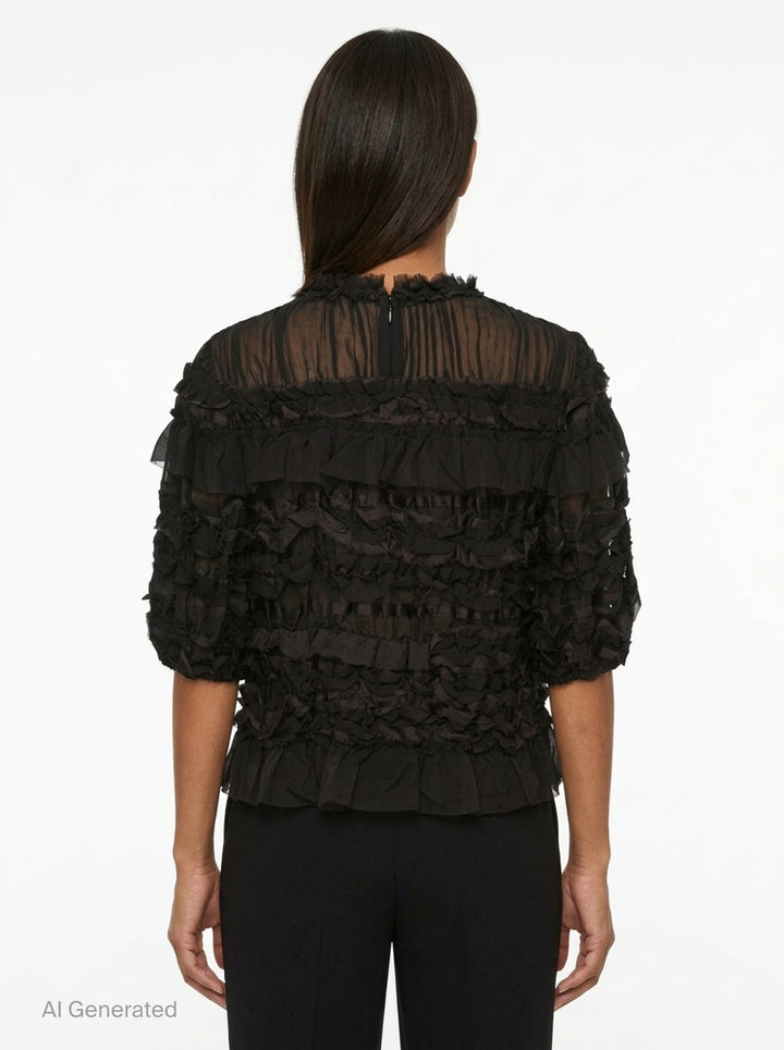 Ulla Johnson Mabel Short Sleeve Silk Top in black — sheer silk with cascading tiered ruffles, frayed collar trim, and puffed short sleeves - back