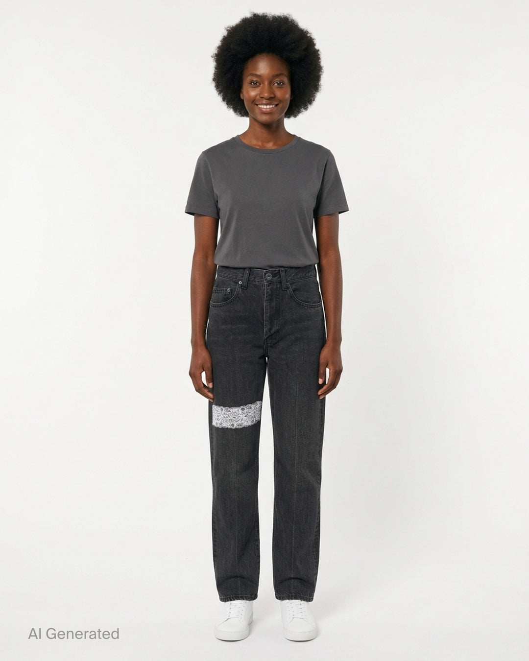 Undercover washed black straight-leg jeans with a white floral lace strip across the knee, shown from the front - front