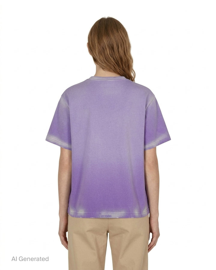 We11done Anniversary Teddy Graphic Tee in washed purple featuring a crayon-style teddy bear birthday illustration, multicolour logo lettering, and paint splatter details on an oversized cotton silhouette - back