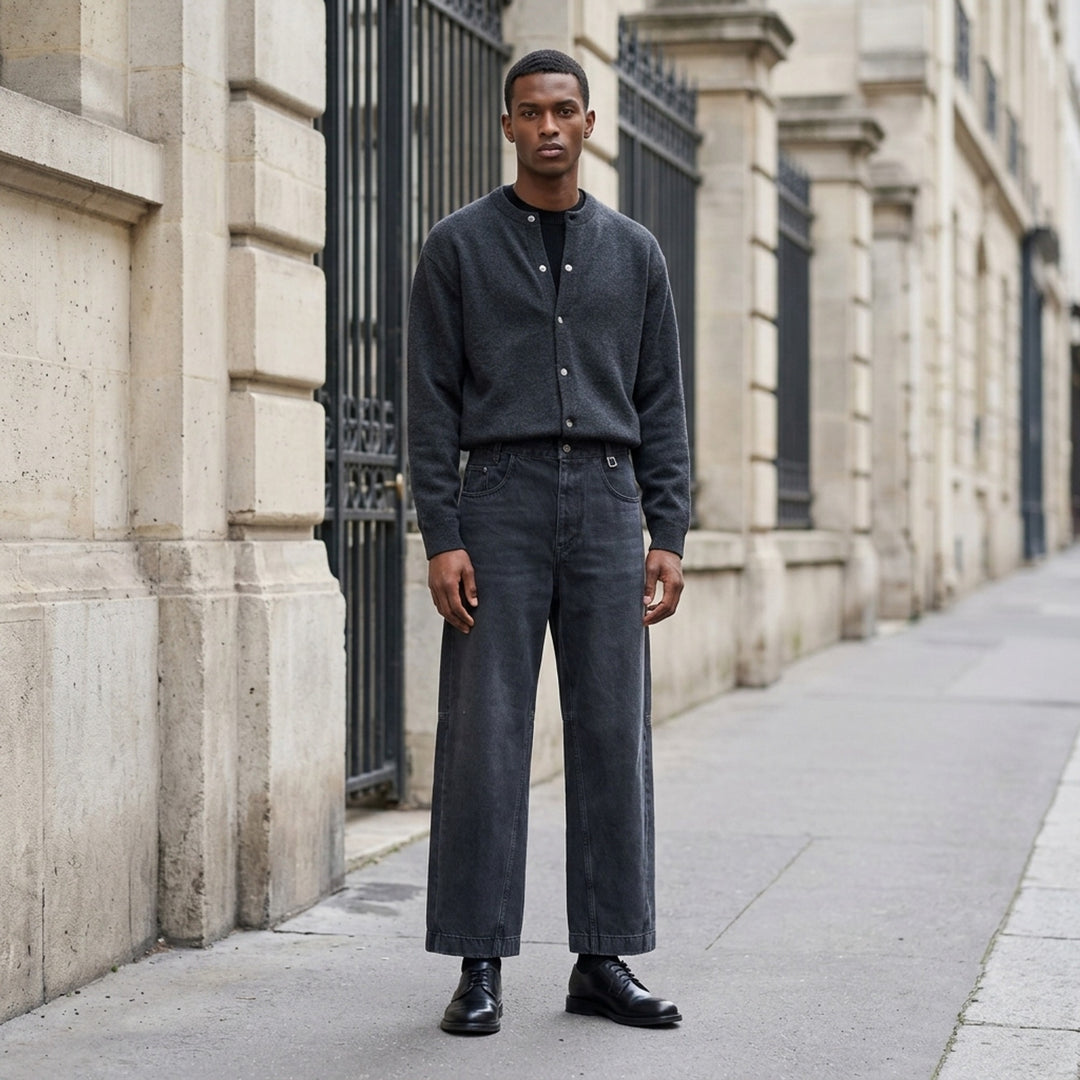 Wooyoungmi wide leg jeans in washed dark indigo denim with paneled knees and square metal waistband hardware, shown flat from the front - lifestyle