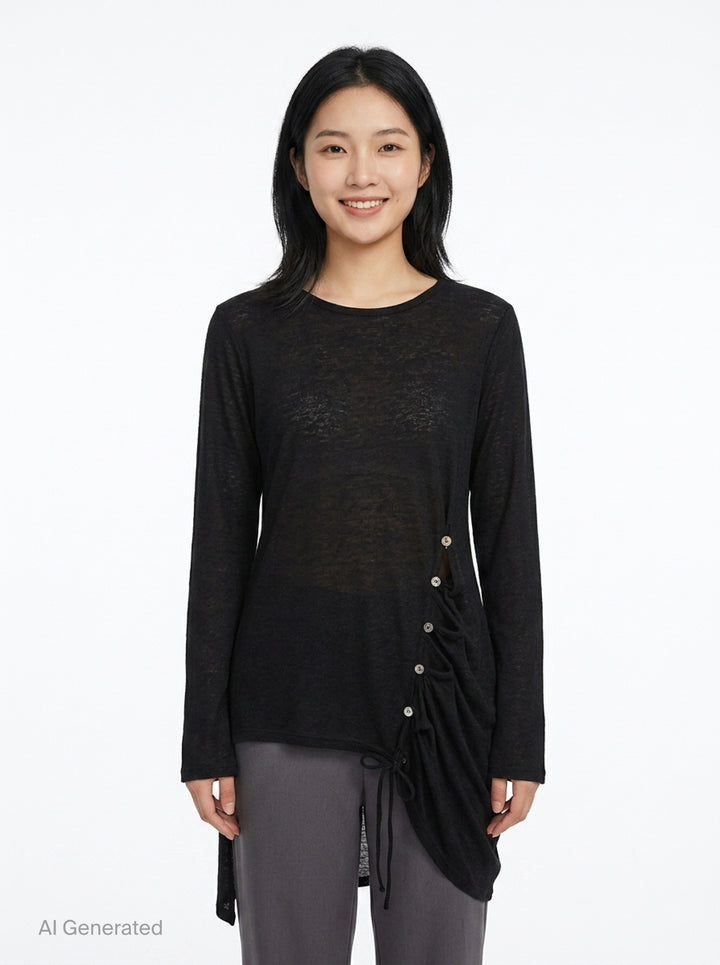 Y's black long-sleeve crew-neck knit top with asymmetric draped panel, vertical shell buttons, and adjustable drawstring tie creating a ruched sculptural effect - front