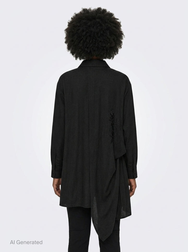 Yohji Yamamoto Tuck & Drape Blouse in black, featuring an asymmetric draped hem, button-through front, point collar, and long sleeves with buttoned cuffs - back